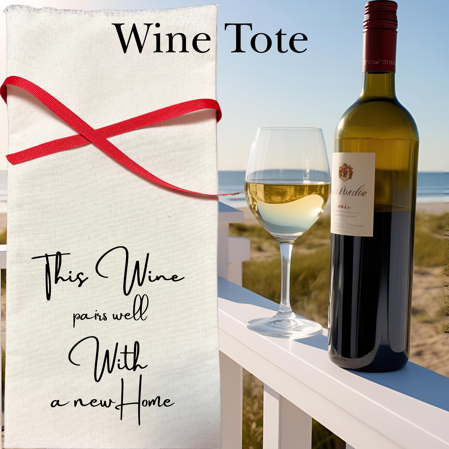 Wine tote with 'This wine pairs well with a new home' text near a bottle of wine and a glass on a beach setting