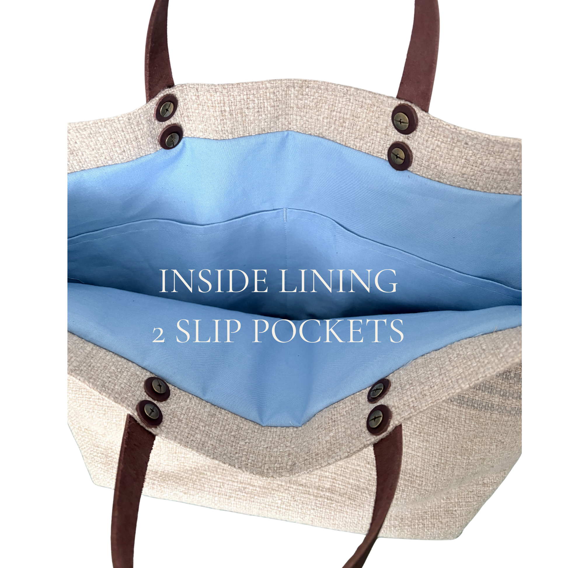 Tote bag with blue interior lining and brown handles on a white background showing two interior slip pockets