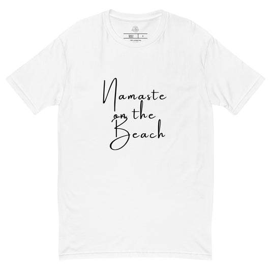 White t-shirt with  'Namaste on the Beach' printed on it, on a white background